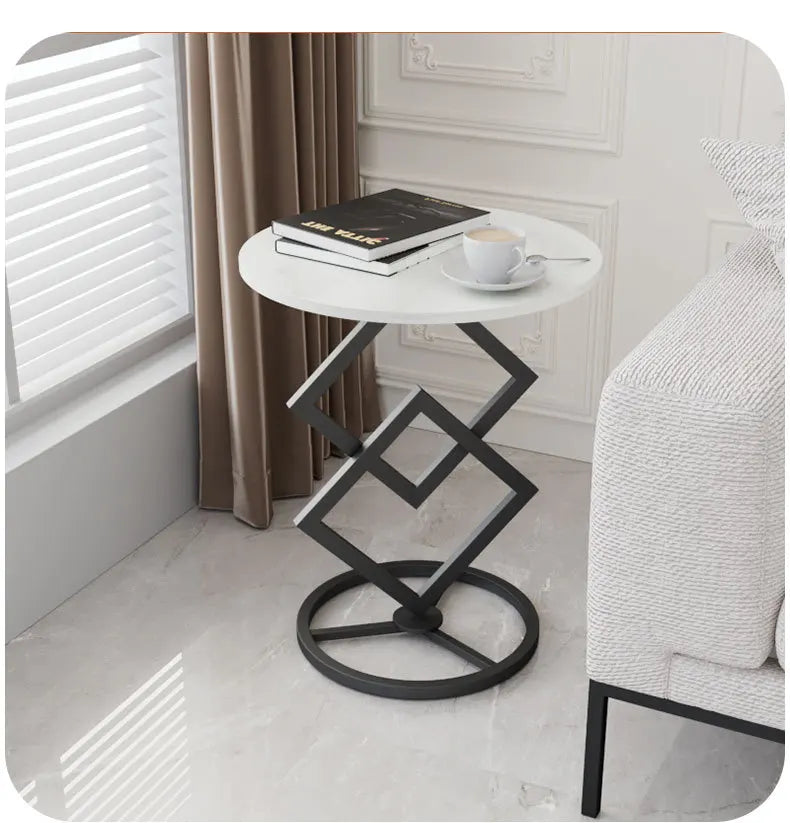 A luxury round rock plate coffee table with a metal frame and wooden top, positioned on a marble textured surface.