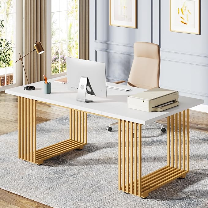 Modern office desk with gold frame and white surface, featuring a laptop and chair.