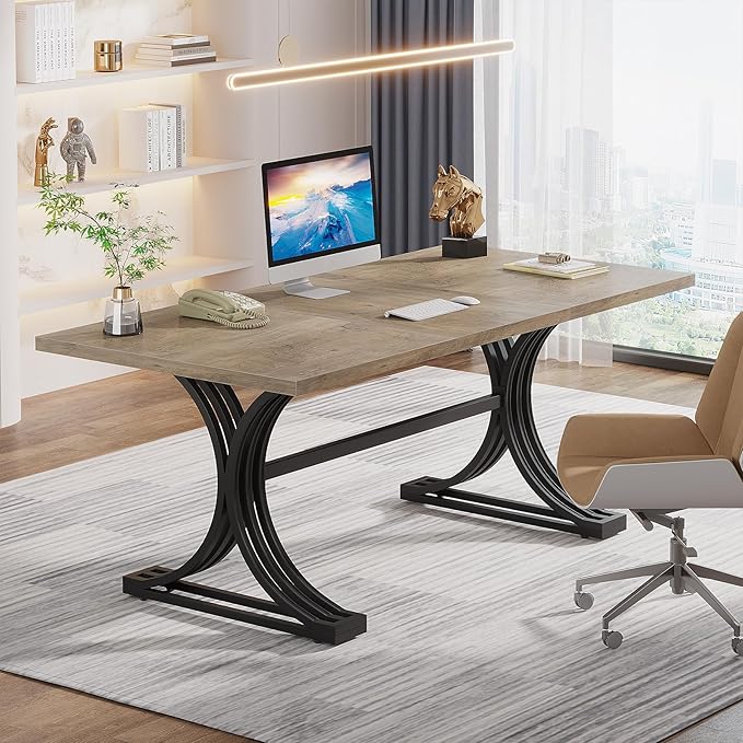 Modern office desk with computer, chair, and decor in a well-lit room.