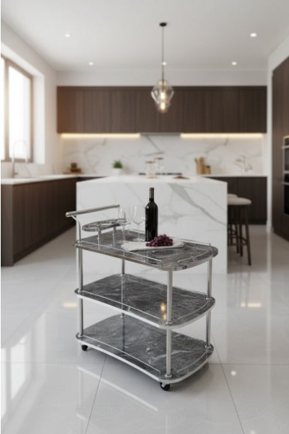 Modern kitchen with a silver three-tier cart holding a bottle and glasses.