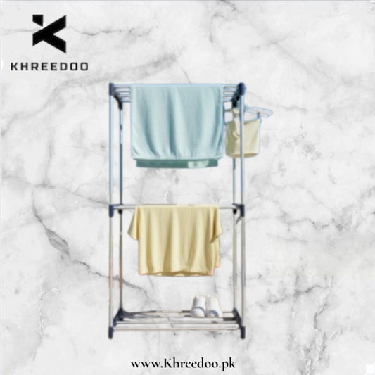 Towel rack with towels on a marble background, featuring the Khreedoo brand.