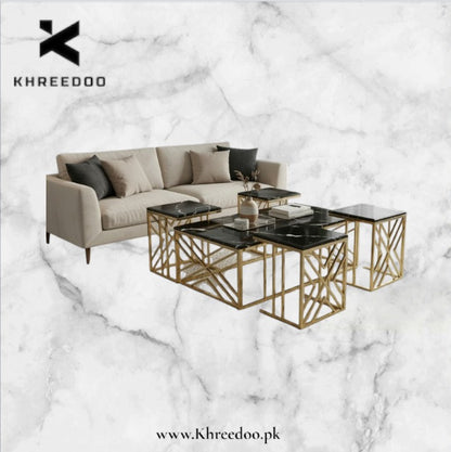 Modern living room setup with a sofa and coffee table on a marble background, featuring the brand 'Khreedoo'.