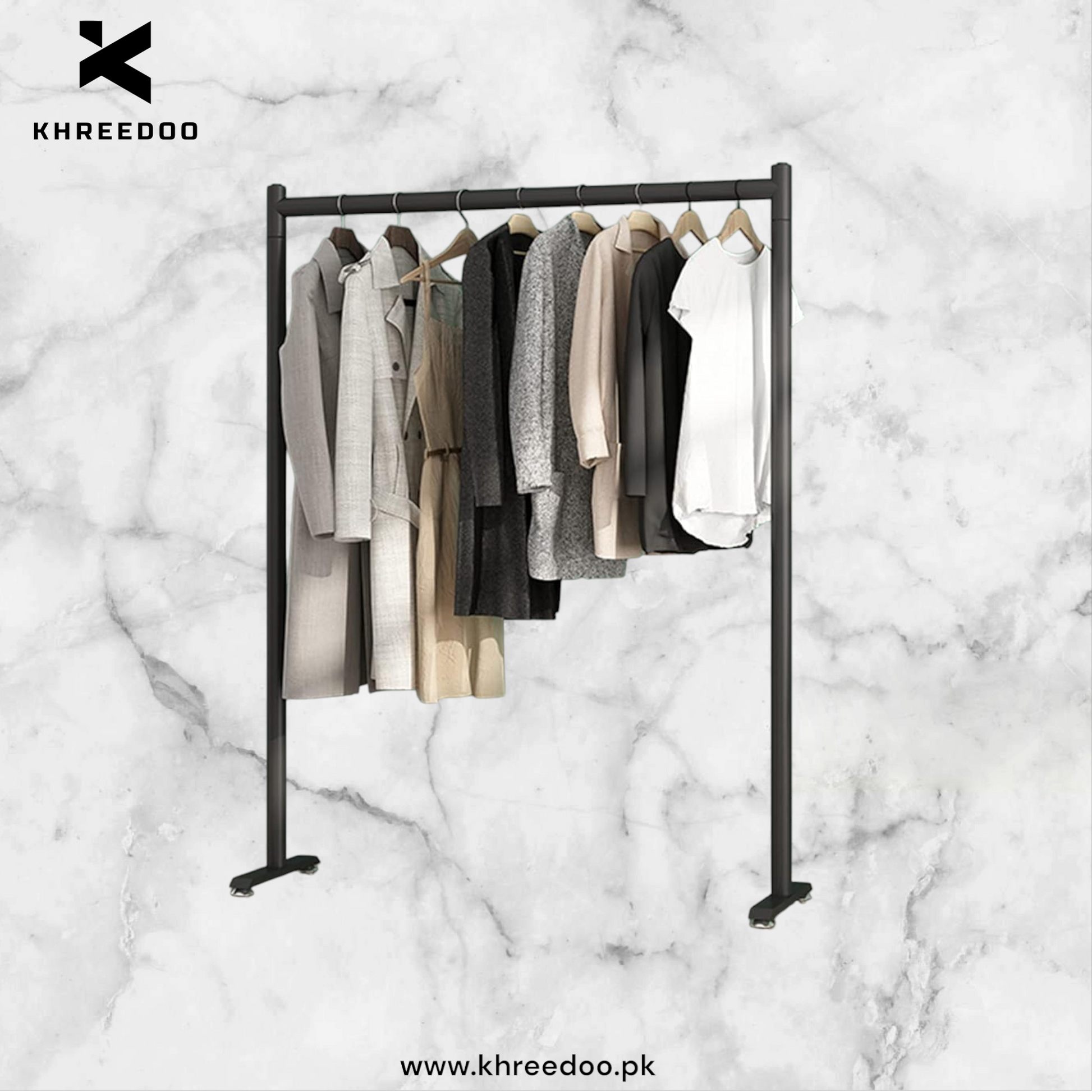 A freestanding metal clothing rack with clothes hanging on it, displayed against a marble background.

